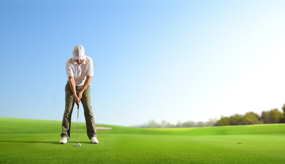 Golfer,putting,golf,ball,to,the,hole,on,green,golf.
