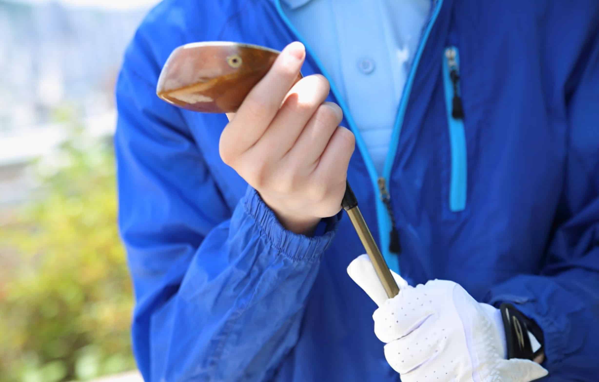 man holding a golf club
